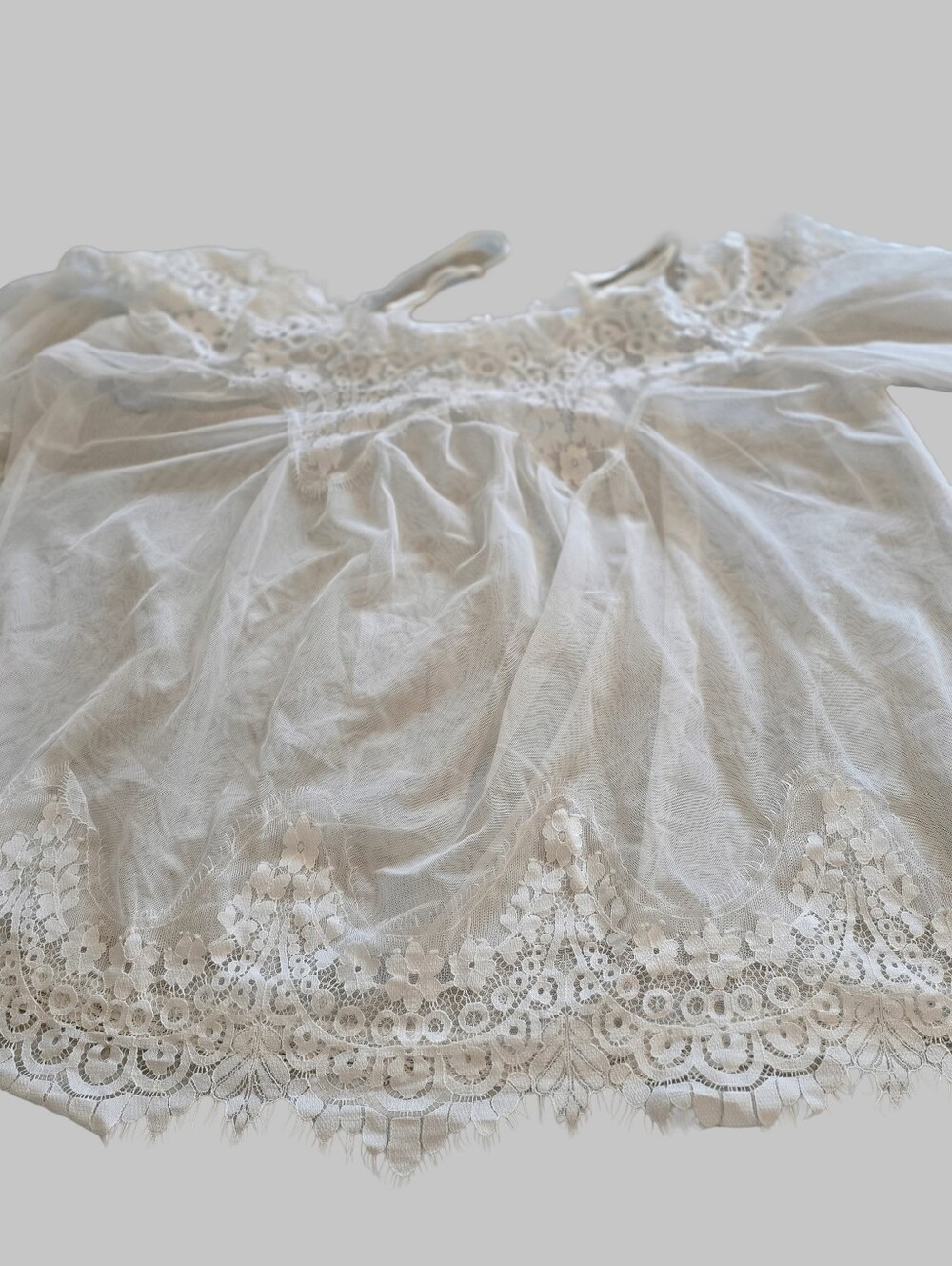 White, sheer lace garment